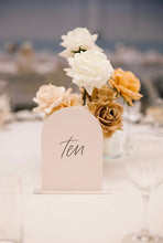 Load image into Gallery viewer, Blush acrylic arch table number Ten with clear acrylic base at a wedding reception