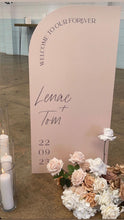 Load image into Gallery viewer, Large blush curved wedding welcome sign for Lenae and Tom with floral styling