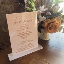 Load image into Gallery viewer, White acrylic bar menu with custom drinks list at a wedding venue
